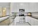 Bright kitchen with white cabinets, granite countertops, and stainless steel appliances at 2473 Kings Arms Dr, Atlanta, GA 30345