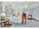 The spacious main bedroom features tray ceilings, a fan, and large windows at 2473 Kings Arms Dr, Atlanta, GA 30345