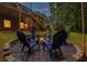 Backyard with a charming fire pit area, surrounded by comfortable seating for cozy outdoor gatherings at 521 Smithstone Se Rd, Marietta, GA 30067
