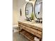 Bathroom with a granite countertop vanity with double sinks and modern fixtures at 521 Smithstone Se Rd, Marietta, GA 30067