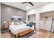 Stylish bedroom showcases a queen bed, modern decor, and a cozy reading nook at 521 Smithstone Se Rd, Marietta, GA 30067