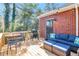 Outdoor deck featuring comfortable seating and a grill, perfect for enjoying outdoor meals and relaxing with scenic views at 521 Smithstone Se Rd, Marietta, GA 30067