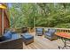 Relaxing outdoor deck furnished with comfortable seating, ideal for entertaining or enjoying peaceful moments in a lush setting at 521 Smithstone Se Rd, Marietta, GA 30067