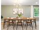 Stylish dining room with a large dining table set for a meal and plenty of natural light at 521 Smithstone Se Rd, Marietta, GA 30067