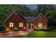 Charming brick home with manicured lawn, walkway to front door, and classic architectural details at 521 Smithstone Se Rd, Marietta, GA 30067