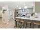 Stylish kitchen with barstool seating, stainless steel appliances, and updated countertops at 521 Smithstone Se Rd, Marietta, GA 30067