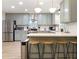 Modern kitchen featuring stainless steel appliances, breakfast bar, and ample counter space at 521 Smithstone Se Rd, Marietta, GA 30067