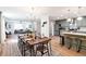 Spacious open layout of kitchen, dining and living area with modern lighting and stainless appliances at 521 Smithstone Se Rd, Marietta, GA 30067