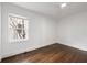 Bright bedroom with ceiling fan, hardwood floors, and a large window at 1612 Alder Se Ct, Atlanta, GA 30317