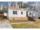 Attractive bungalow featuring neutral siding and a stone foundation at 1612 Alder Se Ct, Atlanta, GA 30317