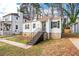A quaint bungalow with a stone foundation and a welcoming stairwell to the front door at 1612 Alder Se Ct, Atlanta, GA 30317