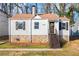 Charming bungalow featuring a stone foundation, neutral siding and brown accents at 1612 Alder Se Ct, Atlanta, GA 30317