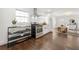 Open layout showcasing the kitchen, dining and living area with stainless appliances and hardwood floors at 1612 Alder Se Ct, Atlanta, GA 30317