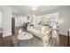 Bright open floor plan with a stylish living room flowing into the dining and kitchen areas at 1612 Alder Se Ct, Atlanta, GA 30317