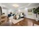 Bright bedroom with a tray ceiling, hardwood floors, neutral decor, and lots of natural light at 1612 Alder Se Ct, Atlanta, GA 30317