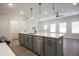 Modern kitchen island with sink, stainless steel appliances, and hardwood flooring at 170 Bluffington Way, Marietta, GA 30066