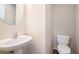 Powder room featuring a pedestal sink and modern fixtures at 2206 Palomino Ln, Conyers, GA 30012