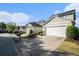 A row of charming homes each with a two-car garage, beautiful landscaping and great curb appeal at 2206 Palomino Ln, Conyers, GA 30012