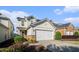 Charming two-story home with a two-car garage, stone accents, and landscaped front yard at 2206 Palomino Ln, Conyers, GA 30012