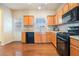 Cozy kitchen featuring stainless steel appliances, wood cabinets and a view to the backyard at 2206 Palomino Ln, Conyers, GA 30012