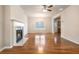 Spacious living room with hardwood floors, fireplace, ceiling fan and a large window at 2206 Palomino Ln, Conyers, GA 30012