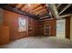 Unfinished basement with window, shelving and access to another room at 4128 Mayflower Sw Ct, Lilburn, GA 30047