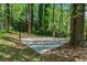 Outdoor basketball court nestled among trees, providing a private and recreational space at 4128 Mayflower Sw Ct, Lilburn, GA 30047