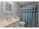 Functional bathroom featuring neutral tones, a vanity, and a shower-tub combination for everyday convenience at 4128 Mayflower Sw Ct, Lilburn, GA 30047