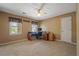 Bedroom with a desk, ceiling fan, and natural light from the window at 4128 Mayflower Sw Ct, Lilburn, GA 30047