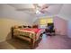 Bedroom with a desk, ceiling fan, and natural light from the window at 4128 Mayflower Sw Ct, Lilburn, GA 30047
