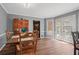 Inviting dining room featuring a wooden table set, natural light, and seamless access to the backyard at 4128 Mayflower Sw Ct, Lilburn, GA 30047