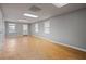 Large empty room with wood flooring and natural light at 4128 Mayflower Sw Ct, Lilburn, GA 30047
