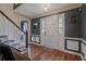 Home entryway featuring hardwood flooring, stairs, and a front door at 4128 Mayflower Sw Ct, Lilburn, GA 30047
