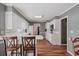 A bright kitchen features white cabinets and updated lighting at 4128 Mayflower Sw Ct, Lilburn, GA 30047