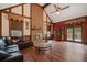 Comfortable living room with a brick fireplace, cozy seating, and an inviting atmosphere for relaxation at 4128 Mayflower Sw Ct, Lilburn, GA 30047
