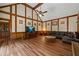 Large living room with beamed vaulted ceiling and wooden floors at 4128 Mayflower Sw Ct, Lilburn, GA 30047
