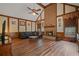 Spacious living room with a brick fireplace, vaulted ceilings, and ample natural light at 4128 Mayflower Sw Ct, Lilburn, GA 30047