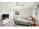 Well-lit bedroom with a bed, closet, and a view of the outdoors at 1548 Highway 81 W, Mcdonough, GA 30253