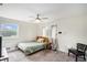 Cozy bedroom featuring a bed, ceiling fan and natural light at 1548 Highway 81 W, Mcdonough, GA 30253
