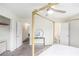 Bedroom featuring a four-poster bed, adjacent to a bathroom and closet at 1548 Highway 81 W, Mcdonough, GA 30253