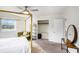 Spacious bedroom with a four-poster bed, closet and shelving at 1548 Highway 81 W, Mcdonough, GA 30253