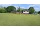 Sprawling lawn complements this home with a brick front, black shutters, and convenient carport at 1548 Highway 81 W, Mcdonough, GA 30253