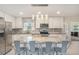 Well-lit kitchen featuring granite countertops, stainless appliances, and a modern, functional layout for cooking and entertaining at 1548 Highway 81 W, Mcdonough, GA 30253