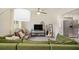 Cozy living room featuring plush seating, a modern ceiling fan, and natural light at 1548 Highway 81 W, Mcdonough, GA 30253