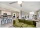 Spacious living area offers modern kitchen views, a brick fireplace, and comfortable furniture at 1548 Highway 81 W, Mcdonough, GA 30253