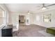 Large living room with desk, chair, and french doors that lead to a brick-walled room at 1548 Highway 81 W, Mcdonough, GA 30253