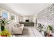 Bright, airy living room with comfortable seating, a stylish fireplace, and large windows offering picturesque views at 1548 Highway 81 W, Mcdonough, GA 30253