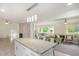 Open concept living space featuring an island kitchen and cozy living area with comfortable seating and abundant natural light at 1548 Highway 81 W, Mcdonough, GA 30253