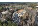 An aerial view of newly constructed townhomes surrounded by a lush tree line at 158 Bluffington Way, Marietta, GA 30066