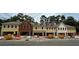 View of multiple new construction townhomes in varying exterior finishes at 158 Bluffington Way, Marietta, GA 30066